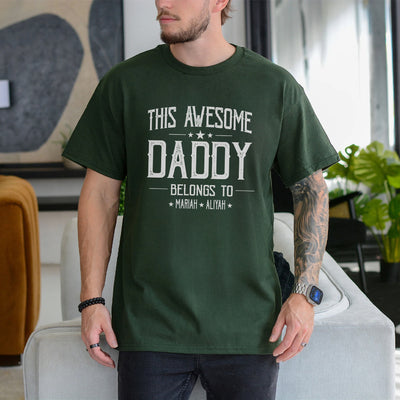 White unisex t-shirt with bold text reading This Awesome Daddy Belongs To with two children's names, dad fathers day gifts idea