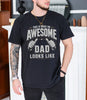 Black unisex awesome dad t-shirt with bold thumbs-up graphic and text This Is What an Awesome Dad Looks Like