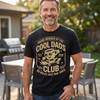 Black unisex cool dads club t-shirt with retro skateboarding cartoon mascot wearing sunglasses, Est. 2026, No Rules Just Dad Jokes graphic