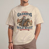 sandCool grandpa wild west t-shirt featuring an old cowboy riding a horse through a desert canyon with bold club-style lettering
