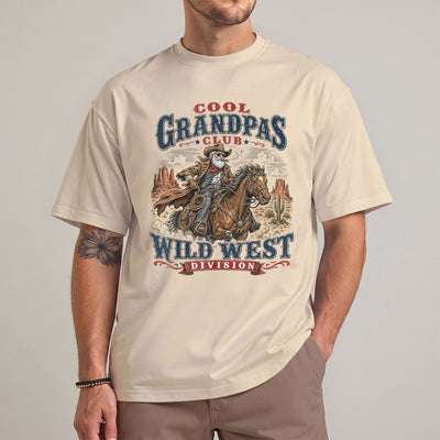 sportgreyCool grandpa wild west t-shirt featuring an old cowboy riding a horse through a desert canyon with bold club-style lettering