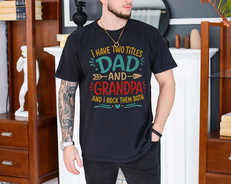Black unisex dad and grandpa shirt with colorful text reading I Have Two Titles Dad and Grandpa and I Rock Them Both