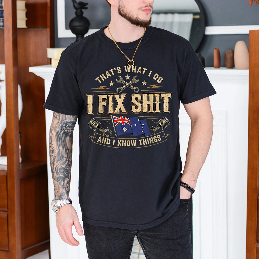 black unisex t-shirt with crossed wrenches, engine pistons, Australian flag, and the phrase I Fix Shit and I Know Things printed on the chest