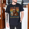Black unisex funny dad bigfoot milk shirt featuring a cool Sasquatch in sunglasses holding a milk carton with retro sunset stripes