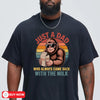 navyunisex t-shirt with a retro sunset graphic of Bigfoot wearing sunglasses holding a milk carton, funny dad bigfoot t-shirt design