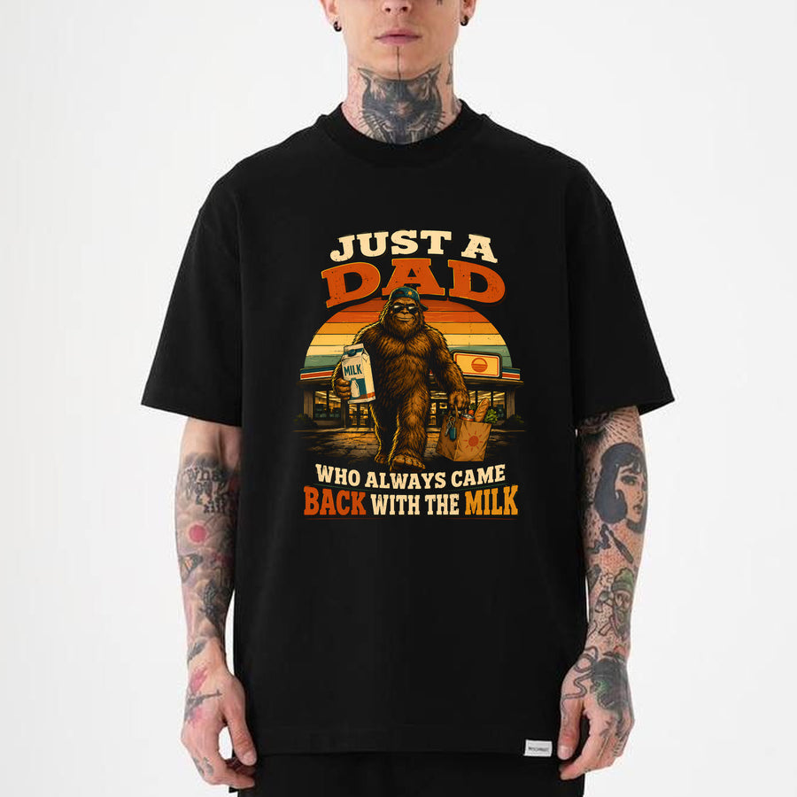 black Funny dad bigfoot t-shirt showing Sasquatch carrying milk and groceries with text Just a Dad Who Always Came Back With the Milk