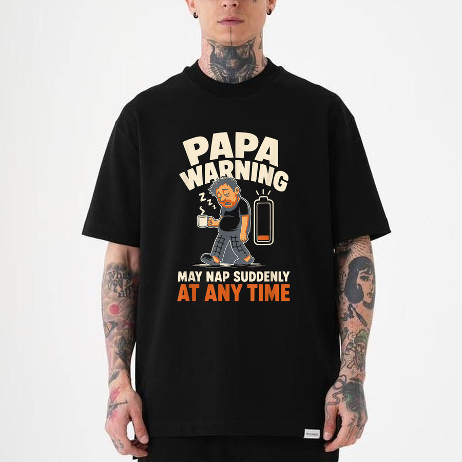 Black funny dad nap warning t-shirt featuring a sleepy cartoon papa holding coffee with a low battery icon and bold humorous text