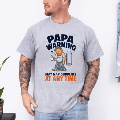 Black funny dad nap warning t-shirt featuring a sleepy cartoon papa holding coffee with a low battery icon and bold humorous text