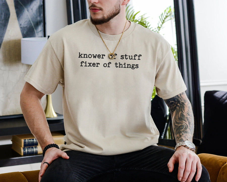 Dark grey unisex t-shirt printed with 'knower of stuff fixer of things' — funny dad shirt for handy men
