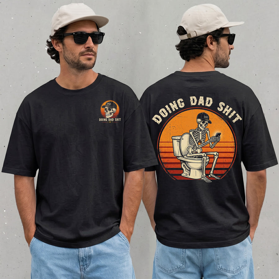 Black unisex funny dad shirt with a skeleton sitting on a toilet using a phone, two-sided print, Father's Day graphic tee