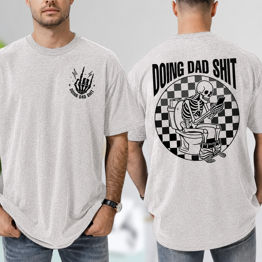 Ash funny dad shirt with a skeleton sitting on a toilet scrolling a phone, checkerboard background, Doing Dad Shit text