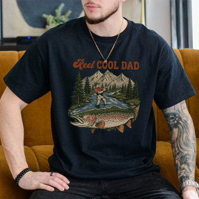 Black funny fishing dad shirt with reel cool dad text and a vintage fly fishing mountain river trout graphic