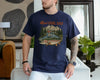Navy funny fishing dad shirt with reel cool dad text and a vintage fly fishing mountain river trout graphic