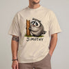 Sand unisex funny raccoon graphic tee featuring a chubby cartoon raccoon hugging a tree stump with the name Jimothy below