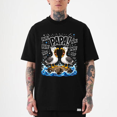 Black unisex funny seagull dad shirt showing two cartoon seagulls shouting Papa on ocean rocks, Father's Day tee