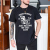 Black unisex t-shirt with a skeleton napping in a recliner holding a remote, just resting my eyes club funny dad design