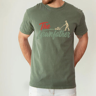 Black unisex lawnfather shirt with retro graphic of a man pushing a lawn mower and bold The Lawnfather text