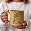 Personalized anniversary mug set with custom initials and date inside a carved heart on a tree illustration, cream and blue coarse ceramic