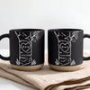 Personalized anniversary mug set with custom initials and date inside a carved heart on a tree illustration, cream and blue coarse ceramic
