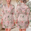 Personalized birth flower bridesmaid robe in light blue satin with orange florals, custom name Charlotte and monogram on back