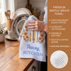Personalized birth flower kitchen towel with custom name, vintage stripe pattern, baking utensils and floral illustration in pink, yellow and blue