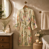 Personalized bridesmaid robe in burgundy with pink carnation floral print and custom name on the back