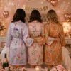 Personalized bridesmaid robe in burgundy with pink carnation floral print and custom name on the back