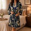 Personalized bridesmaid robe in burgundy with pink carnation floral print and custom name on the back