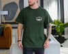 Ivory unisex t-shirt with a trout illustration and the words Reel Cool Dad plus a custom established year on the chest pocket area