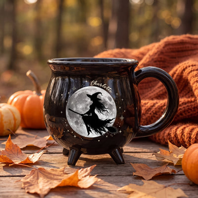 Personalized witch cauldron mug with flying witch and full moon silhouette design and custom name in gold script