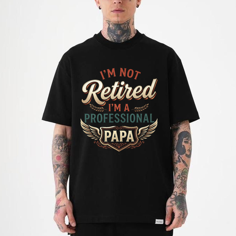 Black unisex t-shirt with retro typography reading I'm Not Retired I'm a Professional Papa, funny Father's Day tee